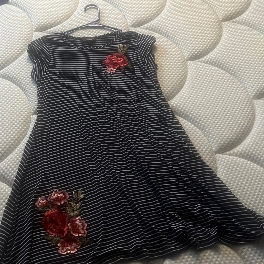 Discreet Black and White Striped Dress with Red Floral Accents